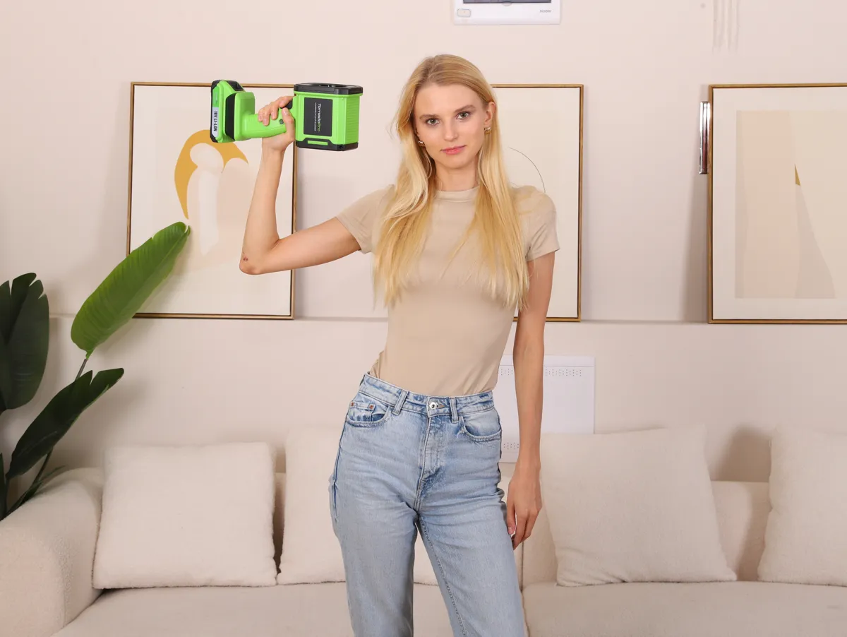 Woman holding the compact TornadoPro blower in one hand